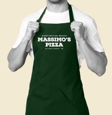 Massimo’s Pizza rebrand logo printed on green staff apron.