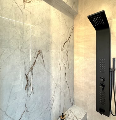 Ground Floor - Full bathroom with heated floors, waterfall shower and natural ventilation.