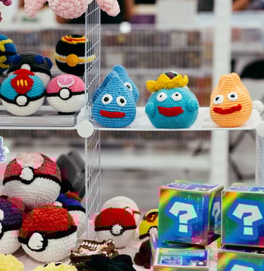 Crochet pokemon characters and poke-balls displayed for sale on shelves