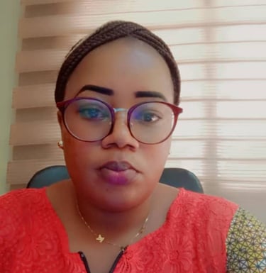 a woman with glasses and a red shirt