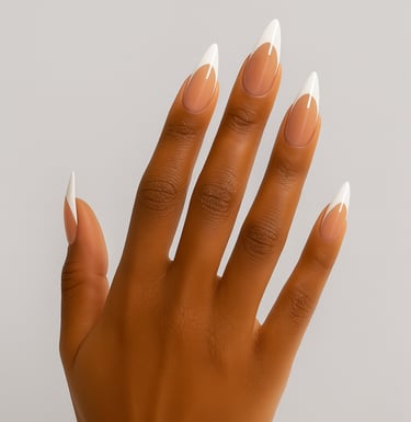 a women's hand with medium/long press on white tip nails