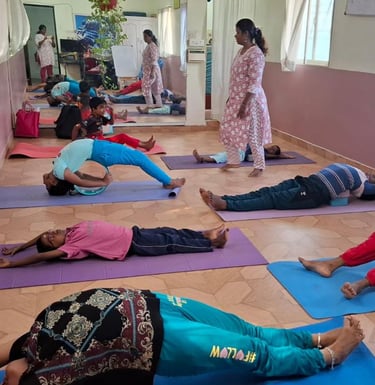 a group of people doing yoga exercises on a mat