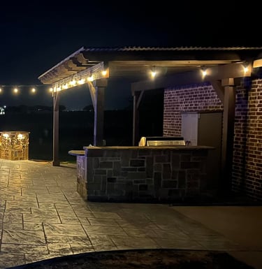 Outdoor Living Space at Night with Pool