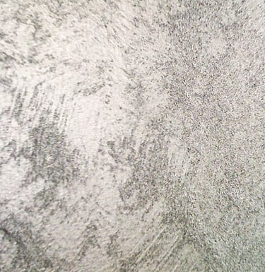 A cooler silver paint sample showing off its beautiful grainy surface