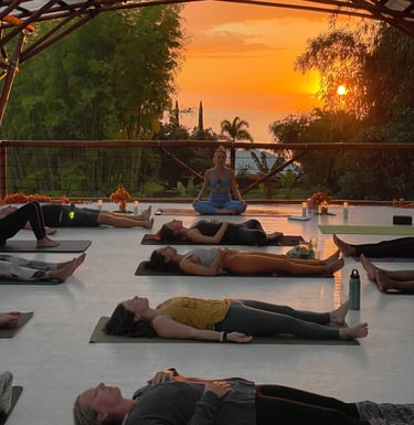 a group of people doing yoga in a large open space