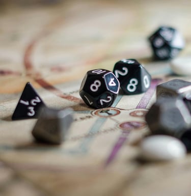 Close up of D20 dice sitting on top of a map from a tabletop game