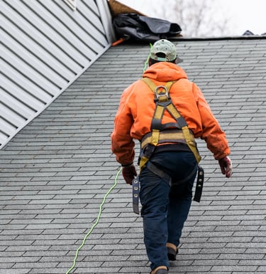 Worker roofing Cleveland Homes