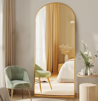 DUMOS arched floor mirror with gold frame styled in a modern bedroom interior