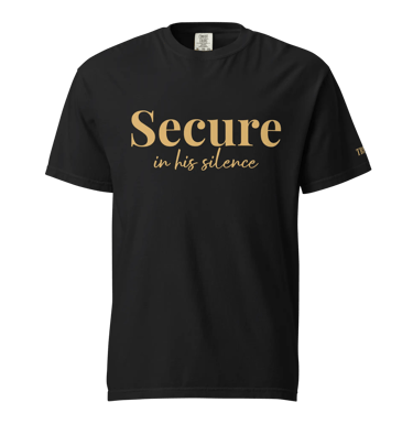 Black cotton t-shirt featuring the gold text Secure in his silence for faith-based apparel.