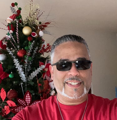 a man with sunglasses and sunglasses on a christmas tree
