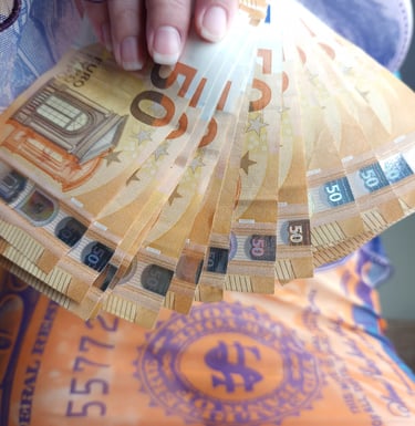 Mistress-Nereid-wearing-a-money-dress-holding-a-fan-of-Euro-bills