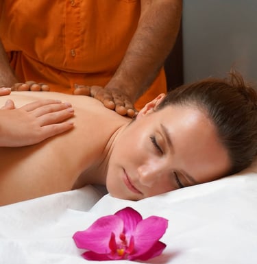 a woman getting a massage at a spa