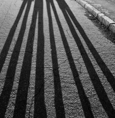 shadows of people standing on a street representing fears