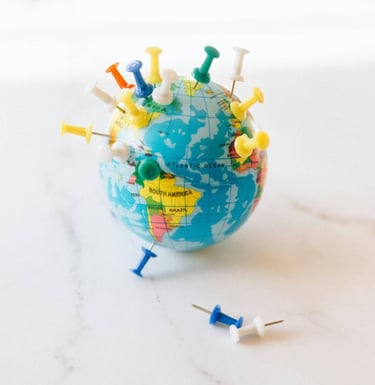 globe of the world with mulitple locations pins inserted