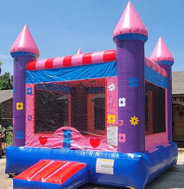 Pink flower bounce house rental in Oklahoma city backyard