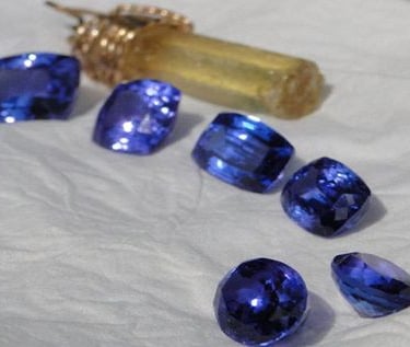 Large Tanzanites Heliodor in background