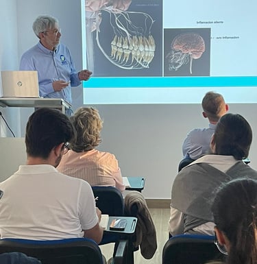 Dr Patrick giving a lecture about the connection between mouth and brain