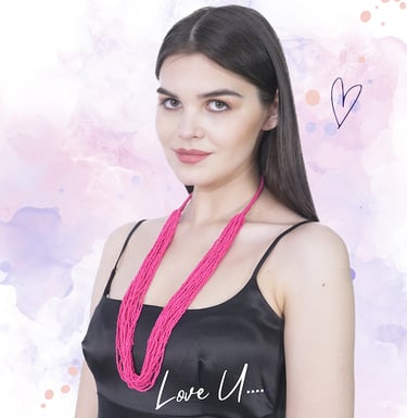 a woman wearing a pink handmade bohemian beaded necklace