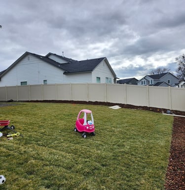 Sloping vinyl tan fence