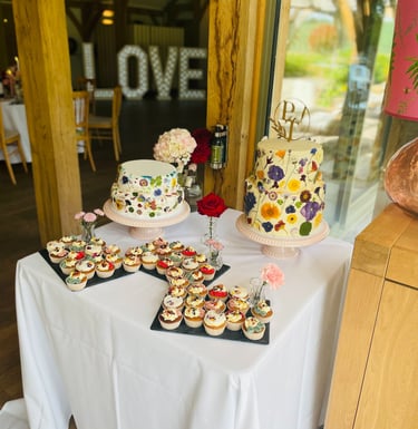 floral wedding cake and dessert table