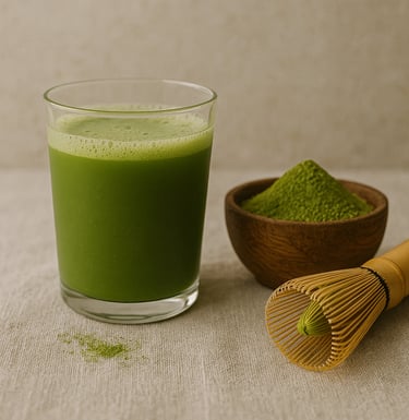 a glass of green tea with matchsticks
