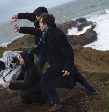 Production company staff directing a film on set