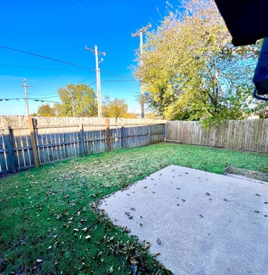 a spacious and green private fenced-in backyard