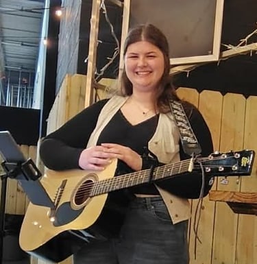Kaleigh with her guitar