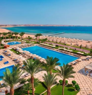 Premier Le Reve Hotel and Spa with blue swimming pools, palm trees overlooking the Red Sea coast.