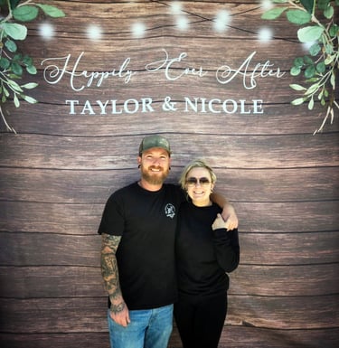 Rustic greenery engagement backdrop