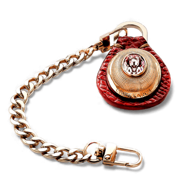 Luxury gold link chain keychain with a red leather pendant and pink crystal embellishment.