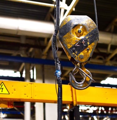 crane hook requiring service, also pendant cable that requires replacement and repairs