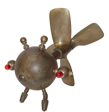 Flying brass bug creature by assemblage artist Tal Avitzur.