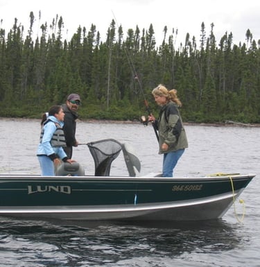a man and woman fishing in a boat