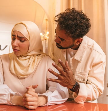 Couple in conversation with woman wearing a hijab, representing culturally sensitive relationship su