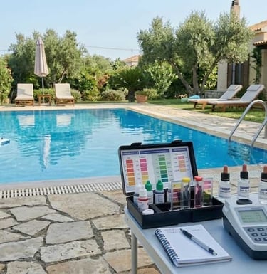 Professional pool water quality testing using a chemical kit by a backyard swimming pool.