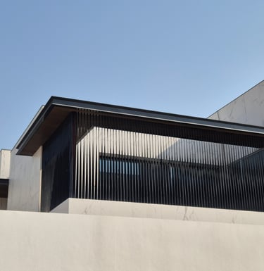 Vertical aluminum louver screen for villa window privacy and modern facade design.