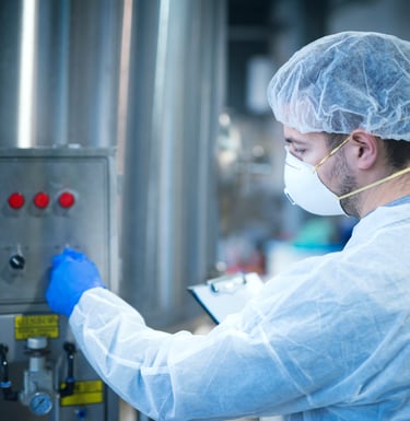 a man in a lab coat and a mask on