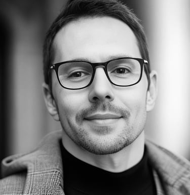 portrait man in a suit and glasses