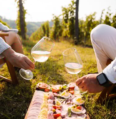 a man and woman sitting at a table with food