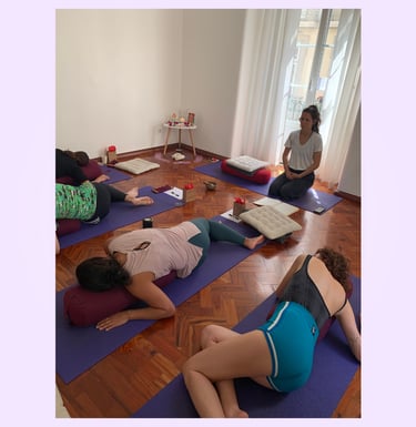Lucy guiding yoga students during Restorative Yoga in Lisbon, Portugal.