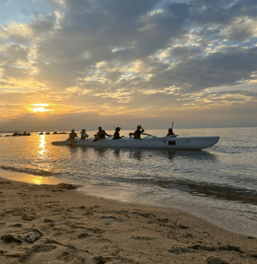 6 seater paddlers at sunset