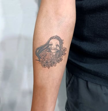 a man with a Nezuko tattoo on her arm