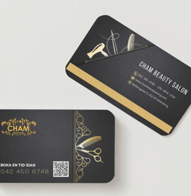 a business card with scissors and scissors on it