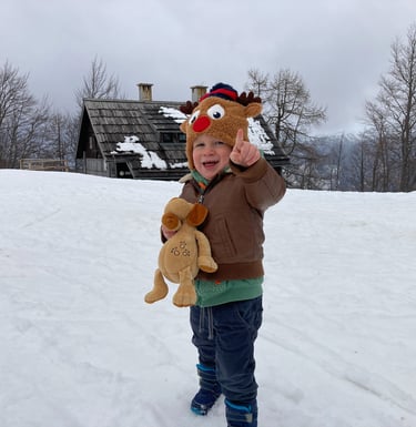 Baby enjoying the snow in Vogel ski resort, Slovenia