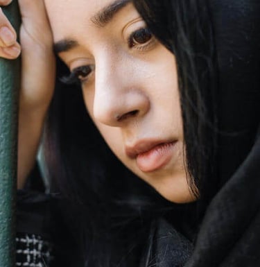 a woman in a black outfit in reflection
