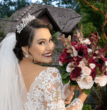 a woman in a wedding dress holding a bouquet