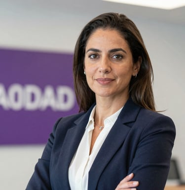 Professional portrait of Tielen Ribeiro, founder of Zempreender. She is dressed in business casual, looking confident and approachable. The background is a soft-focus office with a hint of purple (#6A0DAD) branding.