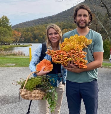 Owners 2123 rivermont holding mushrooms and a basket of mushrooms