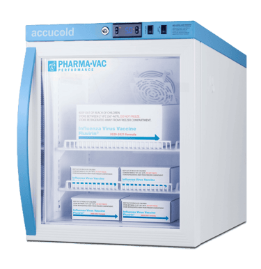 Accucold Pharma-Vac medical refrigerator storing boxes of influenza virus vaccines on glass shelves.
